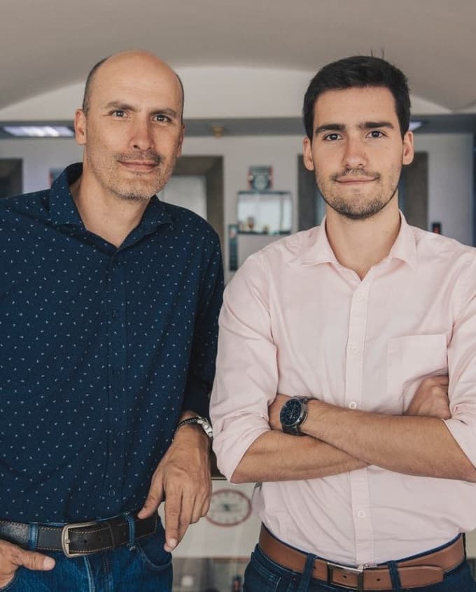 Two business professionals standing with arms crossed